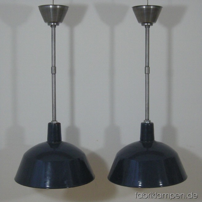 2 p. industrial lamps with gray enameled shades. Material: enameled sheet with iron suspension. Total height: as on the pictures: 75,5 cm (29,7 inches), with one steel tube 48 cm (18,9 inches). With another steel tube of 25 cm (9,8 inches) the total height can be increase up to 100,5 cm (39,6 inches). Height lamp ca. 26 cm (10,2 inches), diameter of the lamp ca. 36 cm (14,2 inches).