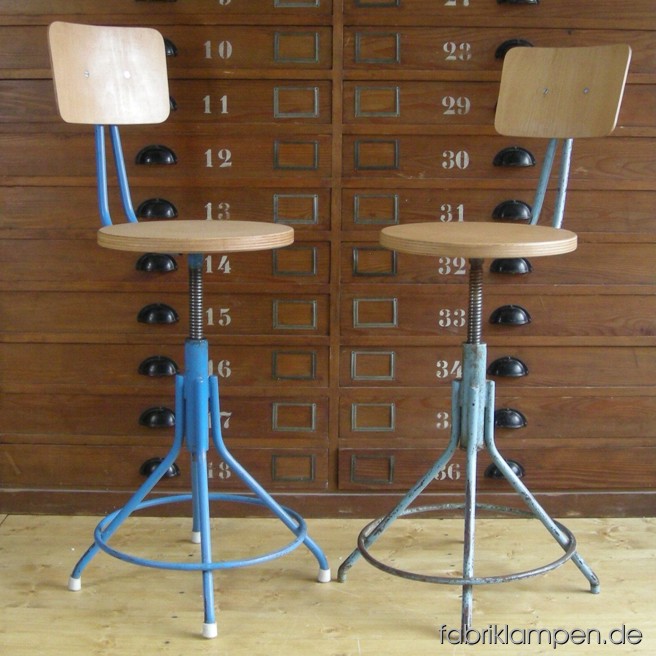 2 pieces old industrial chairs, the sits and backrests are renewed. Sitting height ca. 53 - 67 cm (21 – 26inches), diameter sits ca. 35 cm (13,8 inches).