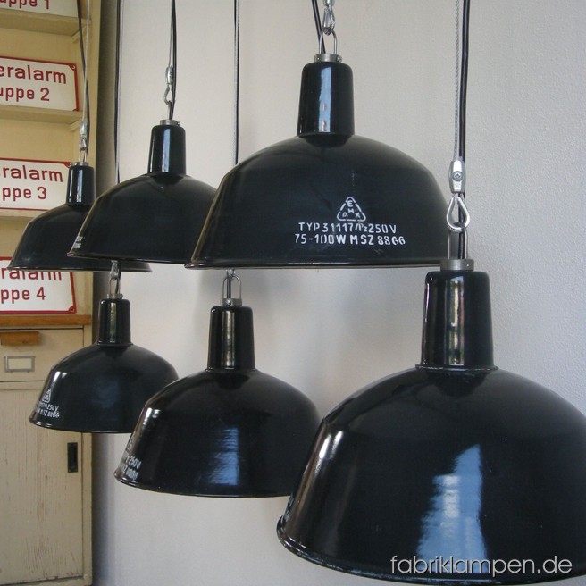Gray industrial lamps with inscription in nice original condition. Material: gray (bluish) enameled sheet, with wire rope suspension. The lamps are cleaned and newly electrified, with E27 sockets. Total height: ca. 23 cm (9 inches). Diameter of the shade ca. 31 cm (12,2 inches). The lamps have safety grids with glass (last pictures). 