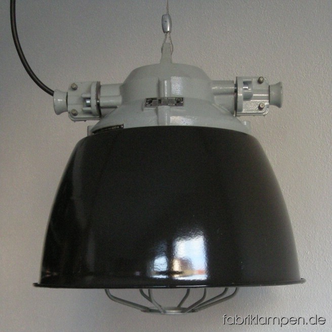Black industrial lamps with enameled shades. Material: black enameled sheet, aluminium head. Newly electrified, with E27 sockets. Height of the lamps ca. 39 cm (15,4 inches), diameter of the shades ca. 39 cm (15,4 inches).