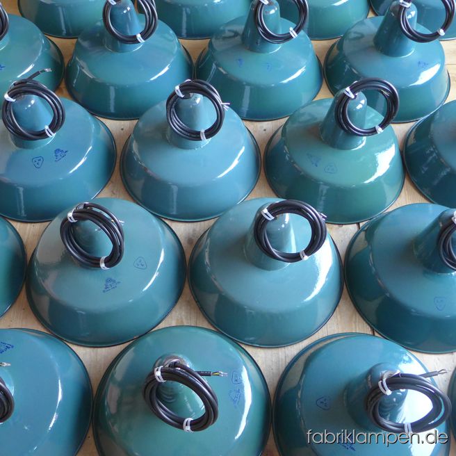 Nice group of bluish green (petrol blue) enameled industrial lamps for a bigger project in Hamburg. Very fine shade of the colour, diameter 41 cm.