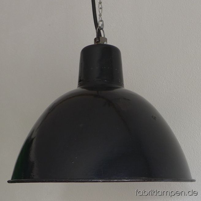 Old black enamel LBL industrial lamp produced by Leuchtenbau Leipzig. The lamp has the typical traces of usage and age. Material: black (inside white) enameled steel sheet. Newly electrified, with E27 ceramic sockets. Height of the lamp ca. 30 cm (11,8 inches), diameter of the shade ca. 42 cm (16,5 inches).
