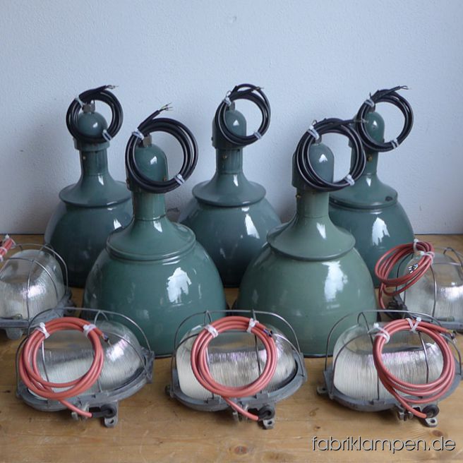 Nice group of old pastel green industrial lamps and wall lamps for a residential project in an old textile factory in Schwitzerland.