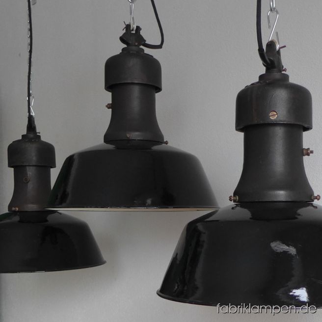 Very rare old industrial lamps produced by Rech. The lamps have the strong traces of usage and age. Material: casted iron top with original brass screws, black (inside white) enameled steel sheet. Newly electrified, with E27 ceramic sockets. We have only 2 pieces in stock. Height of the lamps ca. 43 cm (17 inches), diameter of the shades ca. 40 cm (15,7 inches).