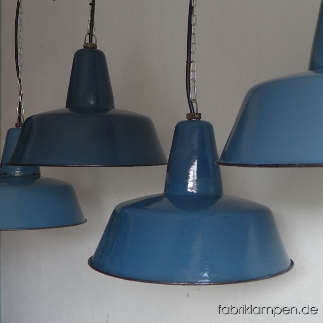 Rare old blue enamel lamps in various shades of blue. Material: blue (inside white) enameled steel sheet. These old industrial lamps have the traces of usage and age. They are cleaned, conserved, newly electrified, with new E27 bulbholders. Height of the lamp is ca. 30 cm (11,8 inches), diameter of the shade is ca. 41 cm (16 inches). 