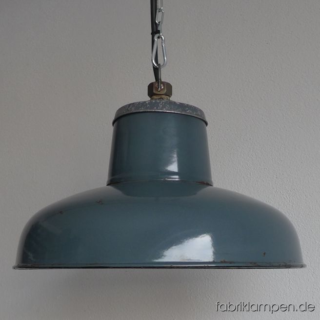 Old enamel factory lamp with enamel shade and aluminium top, hallmarked. Material: bluish gray (inside white) enameled steel sheet, aluminium head. With light traces of age and usage. Cleaned, newly electrified, with E27 ceramic socket. Height of the lamp ca. 23 cm (9 inches), diameter of the shades ca. 39 cm (15,4 inches). The lamp will be shipped with 2 m cable and hanging eye. Chain suspension is possible for an additional charge. 