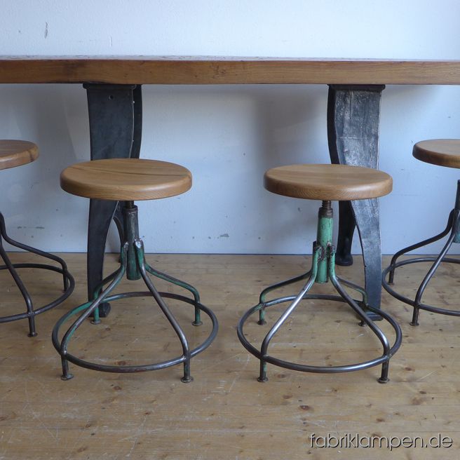 Very nice old industrial stools with oak sits. The pedestals are cleaned and conserved (here and there with remains of original colour like blue or green). Similar chairs in original condition on the last photo. These old stools became new oak sits, they are waxed. The oak massive sits are 3,8 cm (1,5 inches) thick, their diameter amount to 35 cm (13,8 inches). Everlasting, suitable for gastronomy or for your loft-kitchen. Sitting height from 54 to 67 cm (21,25 – 26,4 inches) 