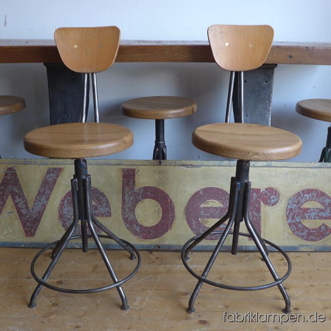 Very nice old industrial chairs with oak sits. The pedestals are cleaned and conserved (here and there with remains of original colour like blue or green). These old chaird became new oak sits, they are waxed. The oak massive sits are 3,8 cm (1,5 inches) thick, their diameter amount to 35 cm (13,8 inches). Everlasting, suitable for gastronomy or for your loft-kitchen. Sitting height from 56 to 67 cm (22 – 26,4 inches) 