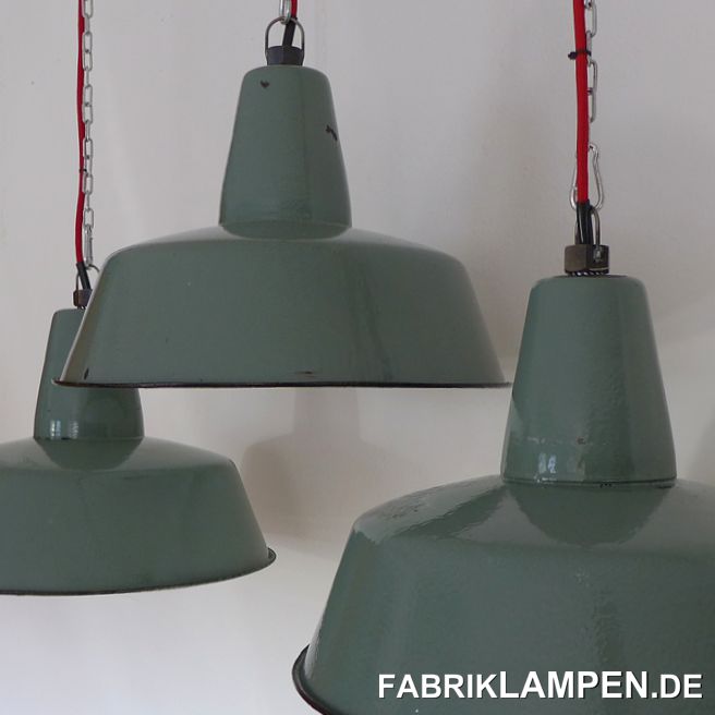 Old pastel green enamel lamps: very rare shade of green. The lamps have some traces of usage and age. Material: pasetel green (inside white) enameled steel sheet. Cleaned and conserved, newly electrified, with E27 ceramic sockets. Height of the lamps ca. 30 cm (11,8 inches), diameter of the shades ca. 41 cm (16,1 inches). 