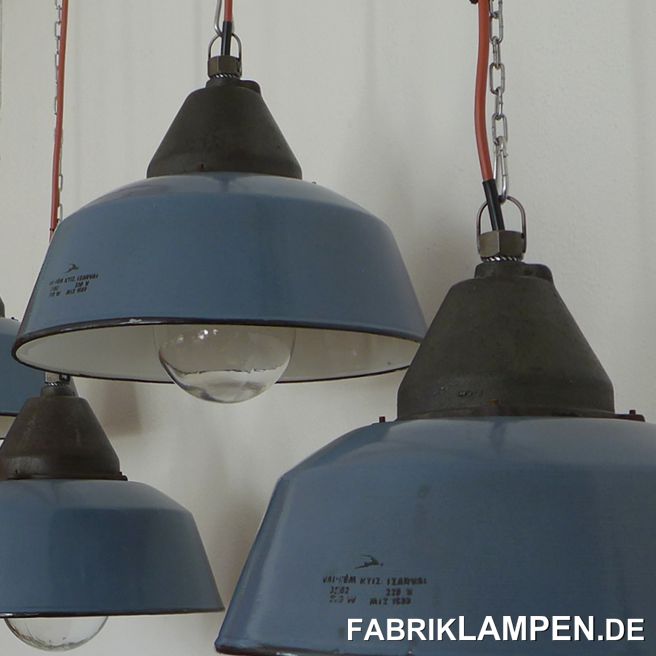 Old blue industrial lamp with casted iron top and enamel shade, hallmarked. Material: blue or grayish blue (inside white) enameled steel sheet, casted iron head and safety glass. Very good condition, with minimal traces of age and usage. Cleaned, newly electrified, with E27 ceramic sockets. Height of the lamps ca. 28 cm (11 inches), diameter of the shades ca. 41 cm (16,1 inches). The lamps will be shipped with 2 m cable and suspension eye (chain suspension is possible for an additional charge). 