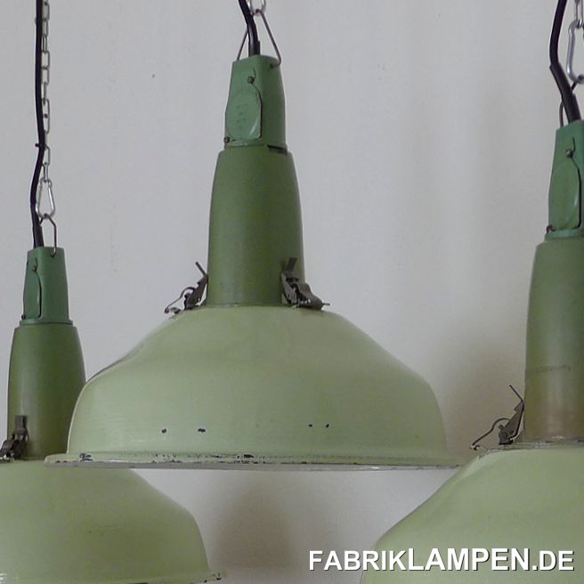 Old industrial lamp, green enamel, with aluminum top.The lamps have the clear traces of the past decades (small chips, rust spots, scratches, discolorations and Co. - we have all dealt with them). They have been restored: cleaned and preserved. The old factory lamps, as new electrified, are equipped with new E27 ceramic sockets. The entire interior of the lamps is new.Material: green on the outside (the color of the shade can be described as white-green), white enamelled steel sheet, aluminum housing.You get the lamps with 2 meters of cable (other lengths or textile cables are of course possible) and massive hanging eyes for safe hanging. The lamps can also be supplied with chain suspension and canopy for an additional charge.The dimensions: diameter of the lamp (shade) 41 cm, height of the lamp 41 cm. 